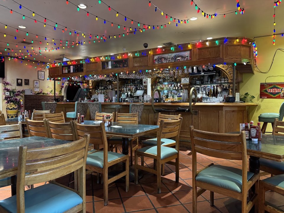 Busy Mexican restaurant with colorful signage.