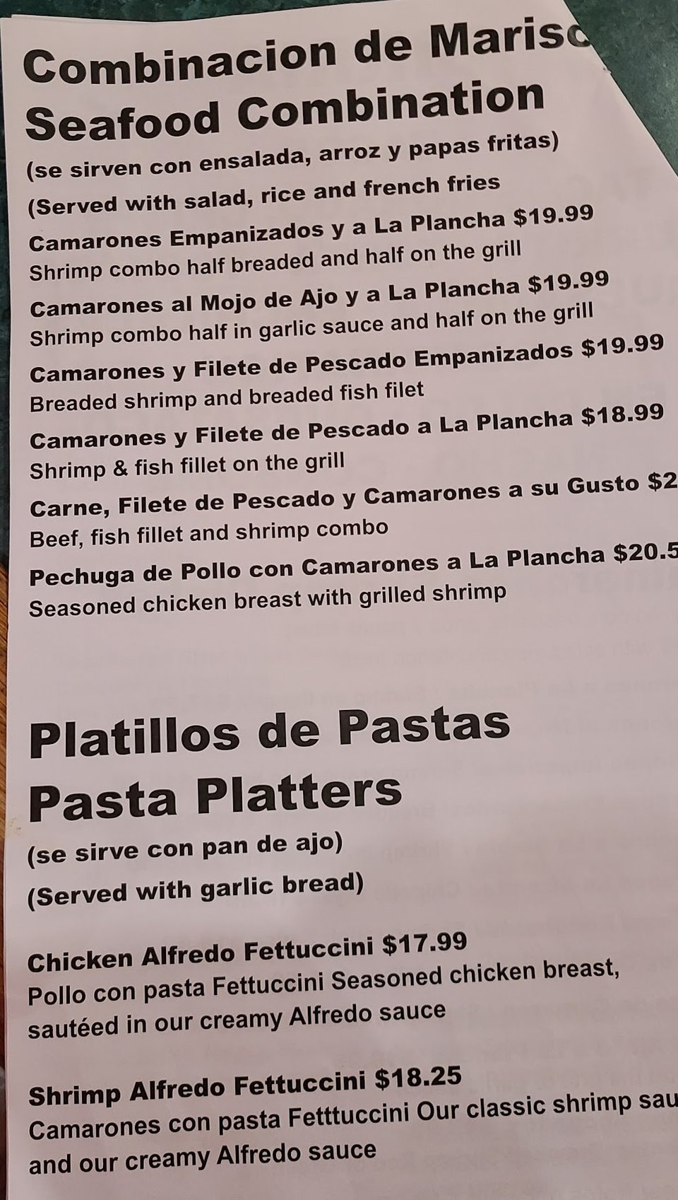 Mexican menu with burritos and seafood plates.