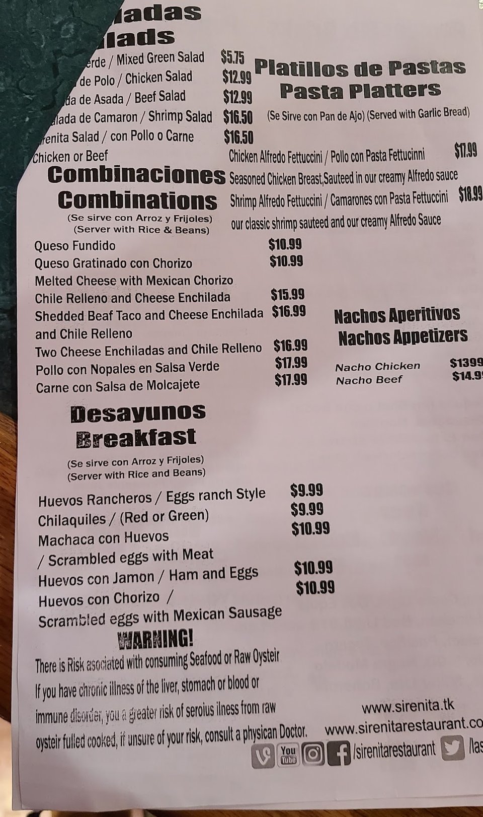 Printed menu showing appetizers and fish fillets.